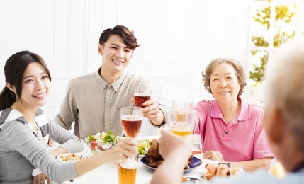 happy asian family having dinner together