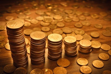 coin stack on black bacground. dramatic light used