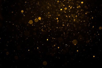 abstract gold bokeh with black background