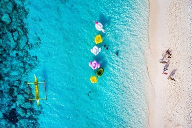 boracay island, philippines, top view of people enjoying the beach on a sunny day.