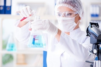 female scientist researcher conducting an experiment in a labora