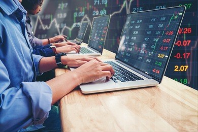 business team investment entrepreneur trading working on laptop stock market exchange information and trading graph