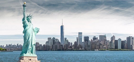 the statue of liberty with one world trade center background, landmarks of new york city, usa