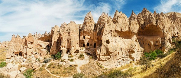 cave town and rock formations in zelve valley, cappadocia, turkey