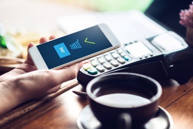 hand and mobile payment in coffee shop ,mobile payment concept