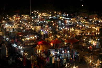 chiang mai thailand. crowded people walking through on tae phae gate walking street market. life style in the night on the street chiangmai, thailand.