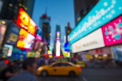 defocus abstract view of times square signage, traffic, and holiday crowds in the lead-up to new year's eve in new york city, usa