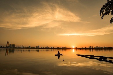 sunset over hanoi's ho tay (west lake)