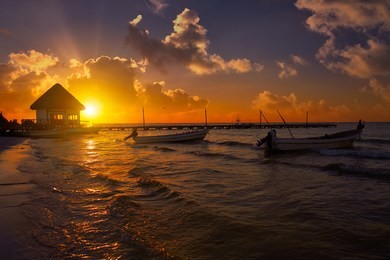 holbox island pier palapa sunset beach in mexico quintana roo