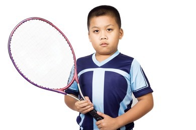 boy asian children playing tennis with racket.