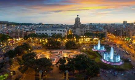 night view of magic illuminated fountains in plaza catalunya in barcelona