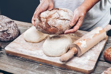 baker preparing a variety delicious fresh bread and pastry