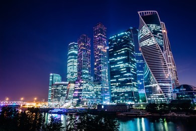 cityscape with business center moscow city on the river bank against the background of the night sky