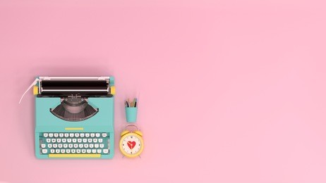 typewriter clock and pen top view on the table colorful education in front of pink wall lovely picture for copy space minimal fruit and object concept pastel colorful lovely picture art