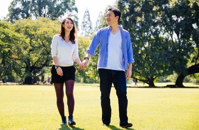 middle age couple spending time together in tokyo on a sunny autumn day