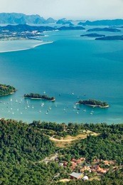 view of blue sky, sea and mountain seen from cable car viewpoint, langkawi, malaysia. picturesque landscape with town among the tropical forest, beaches, small islands in waters of strait of malacca