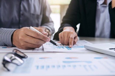 co working conference, business team meeting present, investor colleagues discussing new plan financial graph data on office table with laptop and digital tablet, finance, accounting, investment.