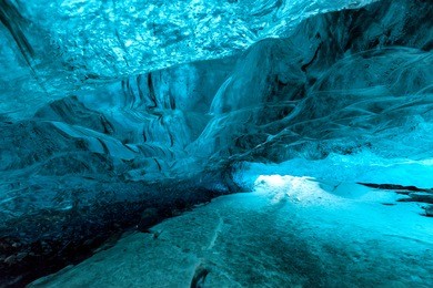 inside an icecave in vatnajokull, iceland, the ice is thousands of years old and so packed it is harder than steel and crystal clear.