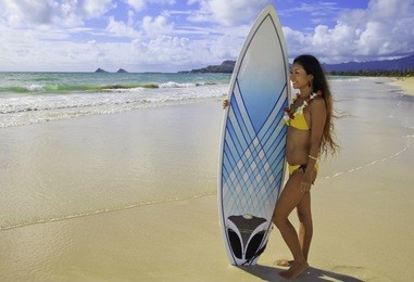 japanese woman with surfboard in hawaii