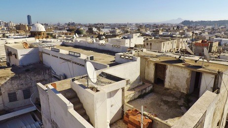 above the roofs of the medina of tunis. in the distance on the right one can see hills of cap bon. tunisia, north africa.