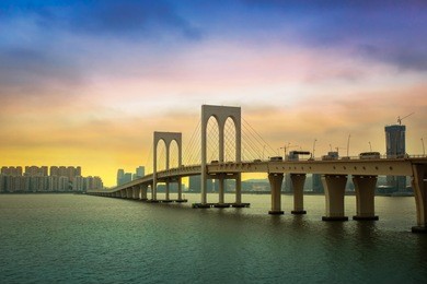 macau sai van bridge at twilight. macau cityscape at dusk. landscape of famous bridge in macaw.