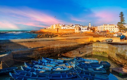 fishing port and essaouira town at the sunset time, morocco