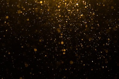 abstract gold bokeh with black background