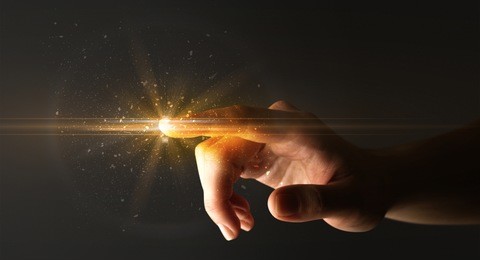 female finger touching a beam of light