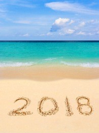 numbers 2018 on beach - concept holiday background