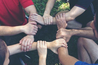group of young sport team hands together, team partners giving fist bump come together for sport battle outdoor. corporate teamwork partnership. meeting,business concept,vintage tone