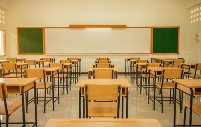 lecture room or school empty classroom with desks and chair iron wood for studying lessons in high school thailand, interior of secondary education, with whiteboard, vintage tone educational concept