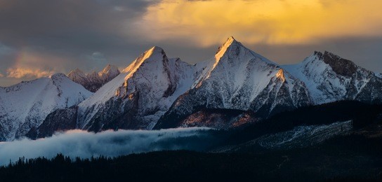 mountain panorama (tatra mountains) with multicolored, dramatic sky