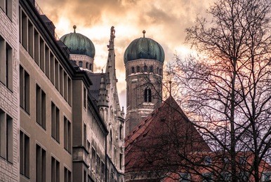 frauenkirche - cathedral of our dear lady in munich with sunset in the background, germany