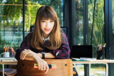 young asian women graphic designer leader the new company self-confident.