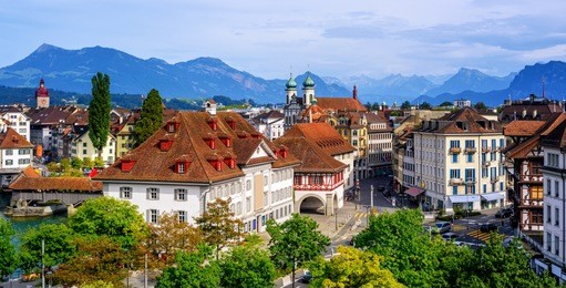 panoramic view of the old town lucerne, switzerland, and swiss alps mountains
