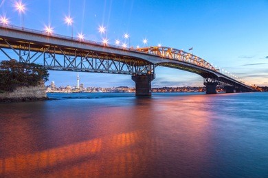 auckland harbour bridge at twilight from northcote point.