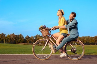 couple riding bicycle together active lifestyle concept