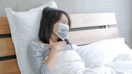 woman get sick and fever lying on the bed
