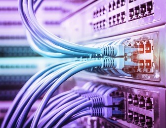 network cables connected to a switch and patch-panel,internet concept background,symbol of global communications