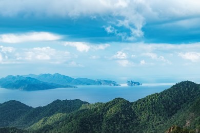 panoramic view of blue sky, sea and mountain seen from cable car viewpoint, langkawi, malaysia. picturesque landscape with tropical forest, beaches, small islands in waters of strait of malacca