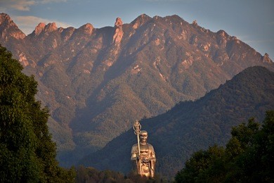 a statue of dizang pusa, bodhisattva who is known in mahayana buddhism as the protector of creatures in the hell. mount jiuhua, anhui province, china. 