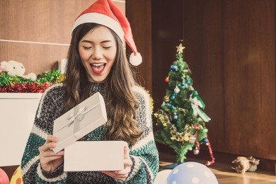 asian woman in christmas holiday party with gift
