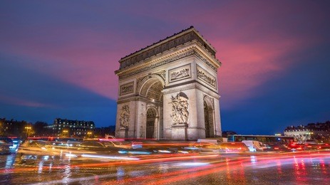 famous arc de triomphe at twilight in paris, france