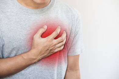 a man touching his heart, with red highlight of heart attack, heart failure, others heart disease