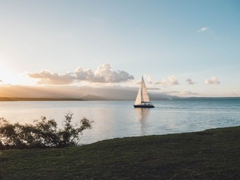 boat and sunset in port douglas, australia