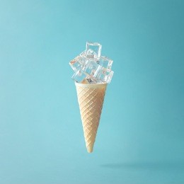 ice cream cone with ice cubes. minimal concept.