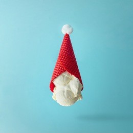 santa claus hat made of upside down vanilla ice cream. christmas holiday minimal concept.