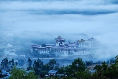 punakha dzong in the morning with the mist and cloud is very beautiful scenic of bhutan