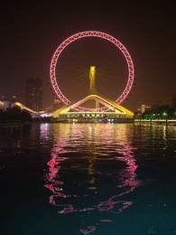 the commercial building and the ferris of tianjin eye.travel in tianjin city, china, october 19th, year 2017