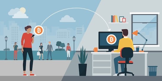 woman sending bitcoins to another user's computer using a mobile app: cryptocurrency and money transfer concept